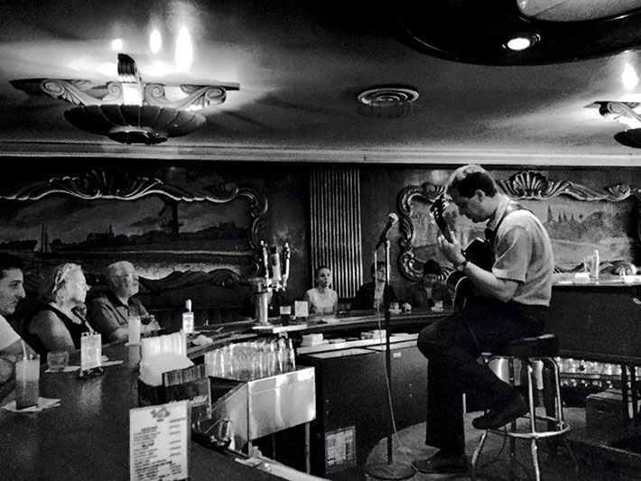 Solo guitar behind the bar at the Green Mill